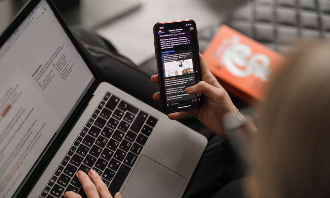 Person using laptop and phone