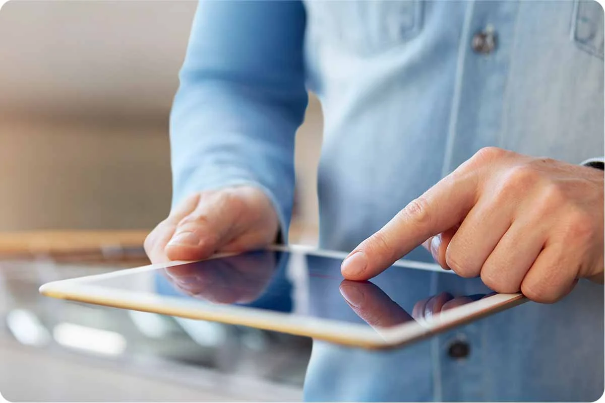 Someone accessing the internet on a tablet