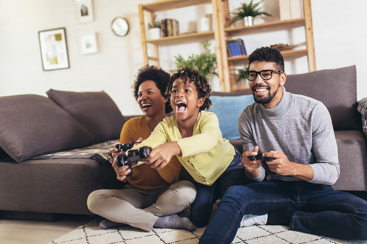 Family enjoying online gaming at home with high-speed internet and reliable Wi-Fi connection. with Optimum